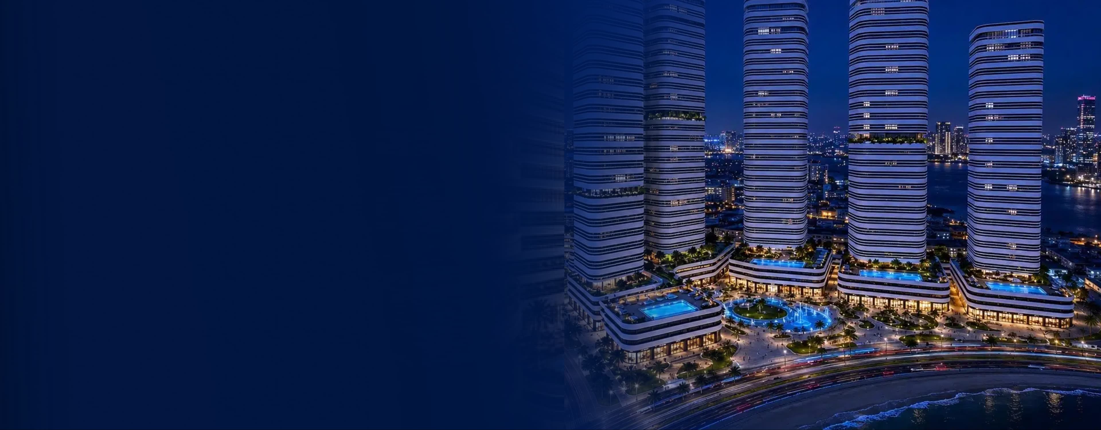 Linar by Alef — six waterfront towers illuminated over the Al Mamzar beach at night