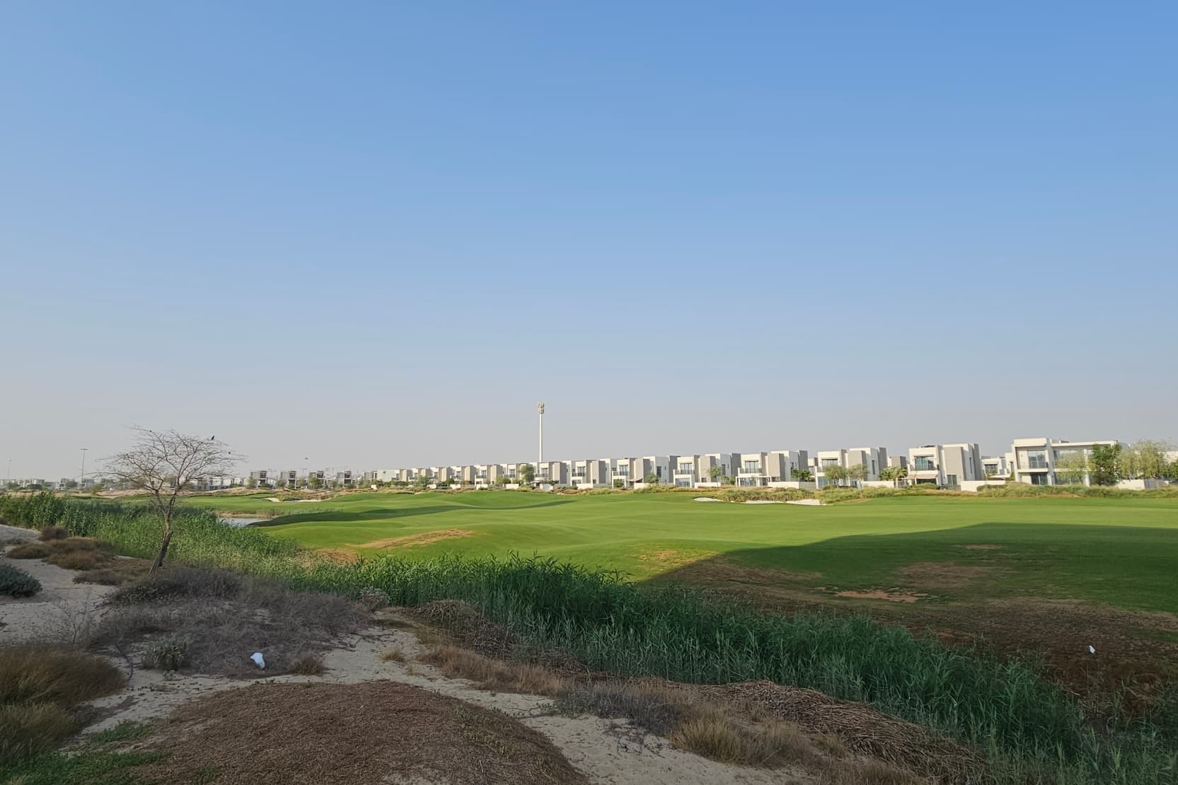 Villas along the open golf course — real photo