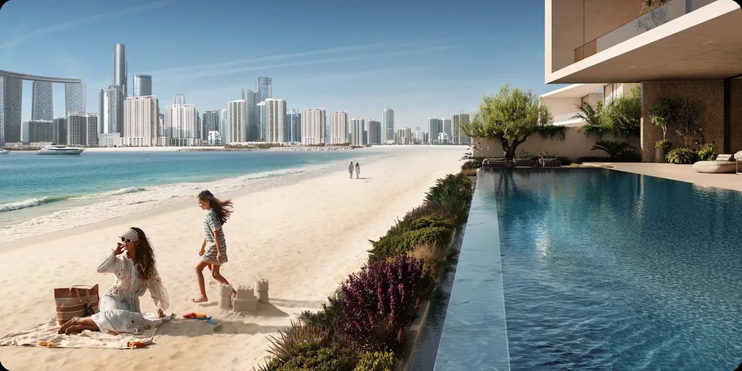 The beach and pool edge at Marsa Al Saadiyat with the Abu Dhabi skyline beyond