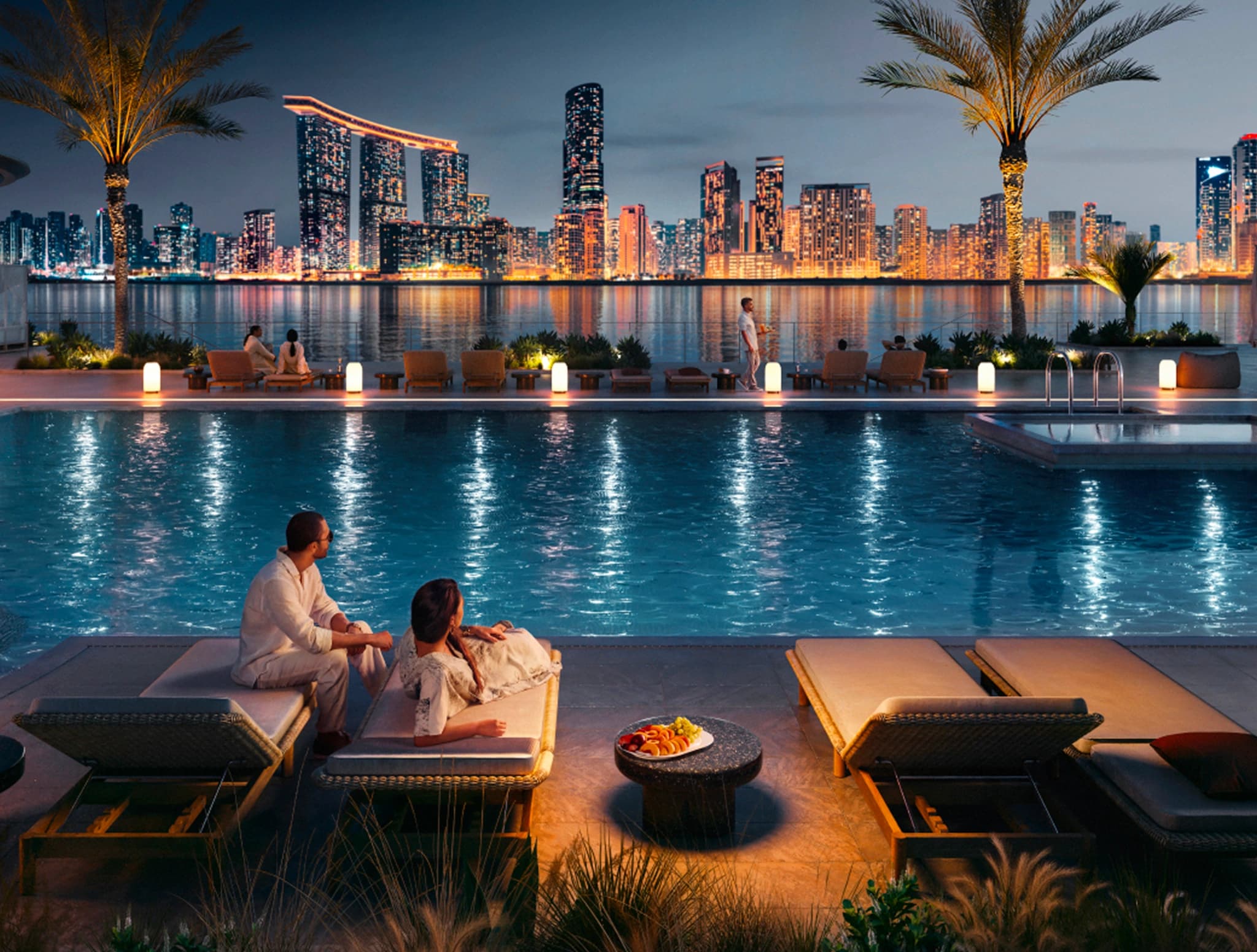 Marsa Al Saadiyat at dusk — a waterfront pool deck facing the Abu Dhabi skyline